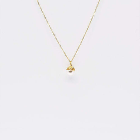 Collier de perle et filigrane d'argent doré